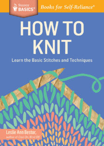 blue book cover with illustration of knitting needles with knitted yarn